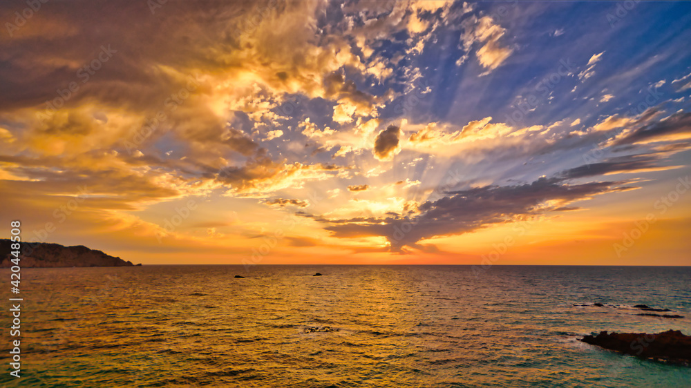 Poster mesmerizing view of a tranquil sea with a breathtaking sunset background in ibiza island, spain