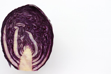 Fototapeta premium Half of red cabbage on a white background. Top view, copy space