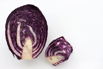 Half of red cabbage on a white background. Top view, copy space