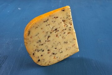 Aged cheddar and Camembert on blue
