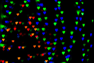 Naklejka na ściany i meble abstract background with lights in the shape of hearts