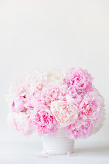 beautiful pink peony flowers bouquet in vase © Olga Miltsova
