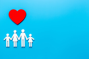 Family wooden figure and heart shape. Life insurance concept