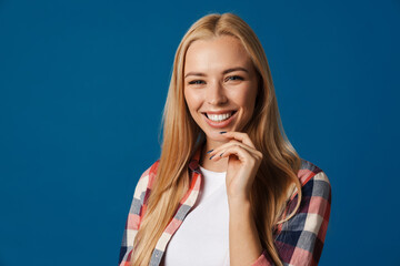 Blonde young happy woman smiling and looking at camera