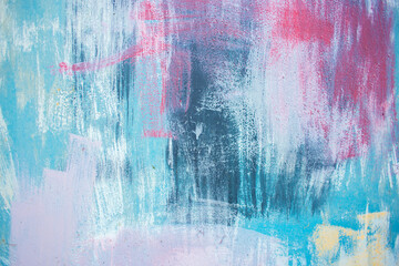 Abstract strokes of paint on the wall as a background. Multi-colored paint strokes on metal