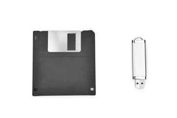 Front view of an old floppy disk and memory stick isolated on white background