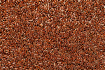 Close-up of Organic Brown flaxseeds (Linum usitatissimum) or linseed Full Frame Background. Top View