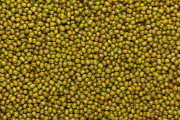 Close up of Organic green Gram (Vigna radiata) or whole green moong dal Full-Frame Background. Top View