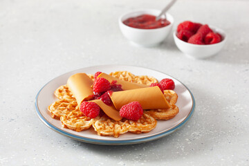 waffles with Norwegian brunost traditional brown cheese and raspberry jam
