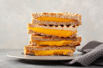 grilled cheese sandwich on gray concrete background