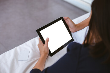 woman finger touch on tablet blank white screen. mockup empty of telephone use for text and graphic.