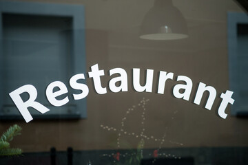Closeup of restaurant signage on the window