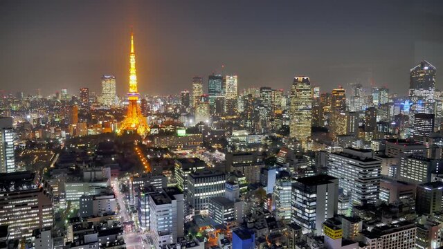 Time lapse – Tokyo city at nighttime with illuminated Tokyo Tower.
