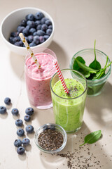 Two glasses of summer cold beverages, blended fruits