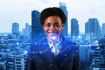 Successful smiling attractive black businesswoman pondering on technology at business process to achieve tremendous growth for client. Tech hologram icons over Bangkok background