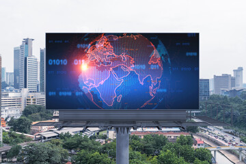 World planet Earth map hologram on billboard over panorama city view of Kuala Lumpur, Malaysia, Asia. The concept of international connections and business.