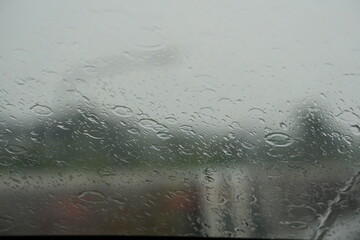 Blurred image of a raindrops on the windshield