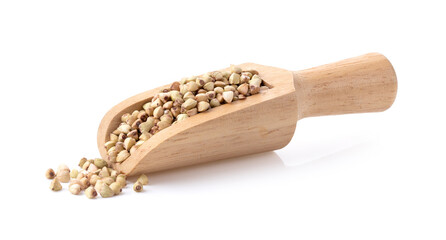 Buckwheat in wood scoop isolated on the white background