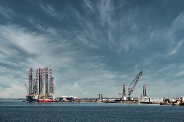 Fototapeta premium Oil and Wind power rigs in Esbjerg harbor. Denmark