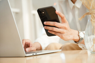 woman work using texting cell phone typing computer.student study education online learning.adult professional chatting on laptop,mobile contact us at Thinking business plan.connecting people concept