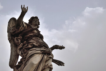 angel statue at Aelius bridge (Ponte Saint'Angelo) over the river Tiber - Rome, Italy