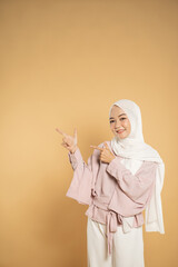 Fototapeta premium beautiful young woman muslim asian woman presenting dressed in the hijab modern style
