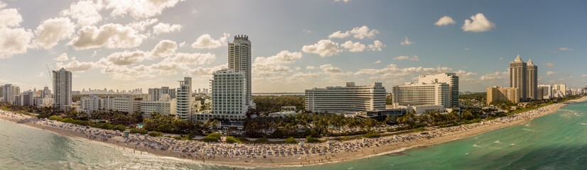 Fototapeta na wymiar Aerial Spring Break in Miami Beach panorama beach crowds 2021