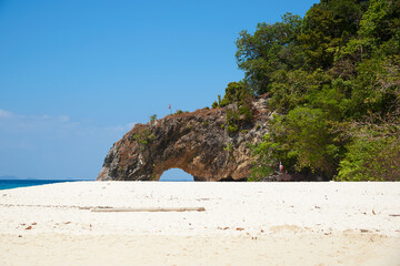 Scene of beautiful mountian with hole at Koh Khai, Satun province, Thailand