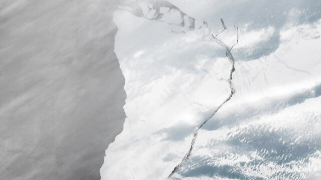 Large iceberg split from Brunt ice shelf Antarctic sea, aerial satellite view animation. Images furnished by Nasa