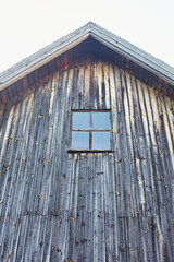 Traditional architecture of wooden houses. Old wooden window