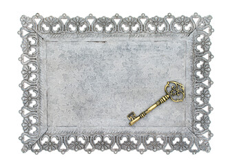 Decorative key with carved patterns of metal frame on a white background
