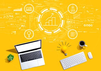 Business growth analysis with computers with a light bulb