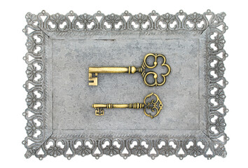 Decorative key with carved patterns of metal frame on a white background