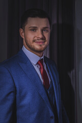 A stylish portrait of the groom preparing for the wedding ceremony.