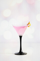 cosmopolitan cocktail with lemon peel