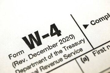 Tax form W-4, tax witholding official document close up