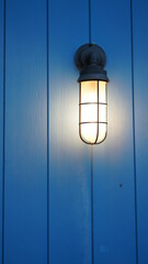 The bright light view with the color wooden wall as background at night