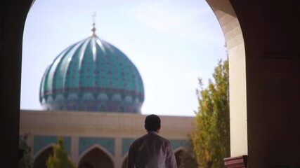 Religious muslim man coming to mosque for praying