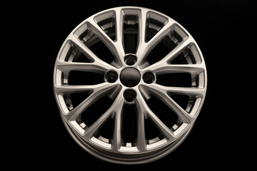 new grey silver alloy wheel on black background
