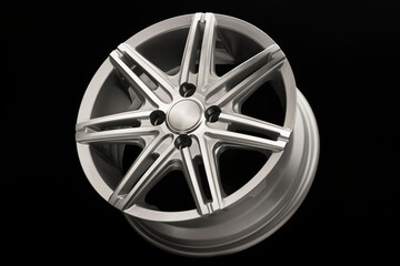 grey new alloy wheel for car, side view close-up, polished