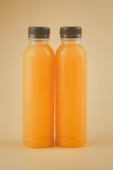 100% pulp organic fresh orange juice are in a bottles with brown cap