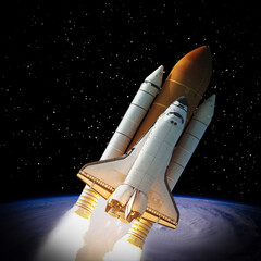 Naklejka premium Rocket and earth. Galaxy and stars. The elements of this image furnished by NASA.