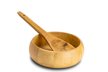 Side view of wooden spoon and wooden bowl on white background.