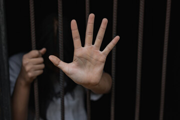 Girl stressed trapped in steel cage.The concept of violence against woman.