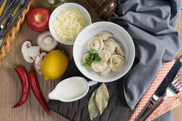 Dumplings with parsley and sour cream