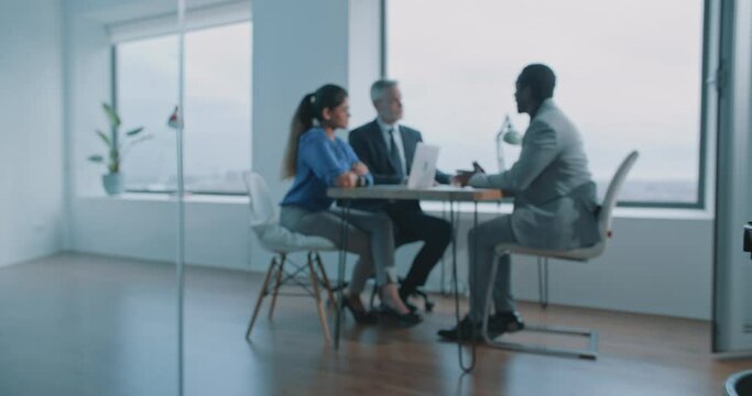 African man candidate communicating with job interviewers