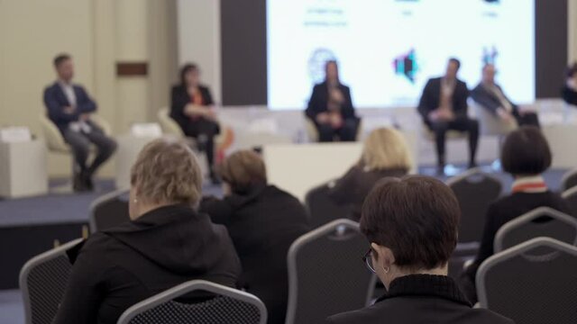 Audience listens to the lecturer