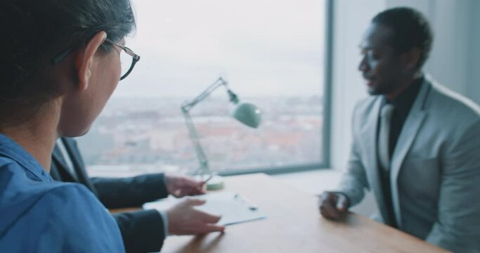 African man candidate communicating with recruiters