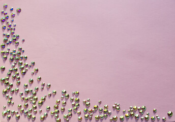 rhinestones on a pink background, top photo. design for text