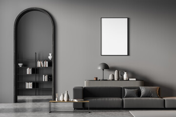 Modern living room interior with arch and blank poster on wall. Black sofa with cushions, coffee...